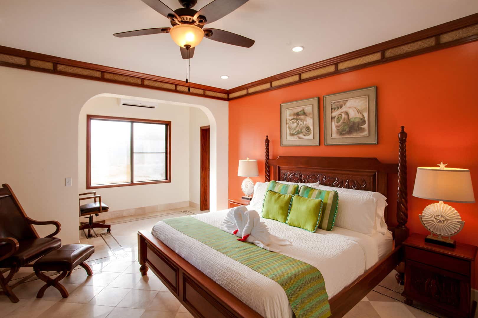 Sideview of the king sized bed in the master bedroom of the Villa Margarita Beachfront Deluxe Rooms at The Resort at Almond Beach