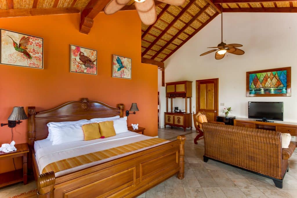 Front facing view of the king sized bed inside of the Colonial Penthouse Rooms at The Colonial Inn