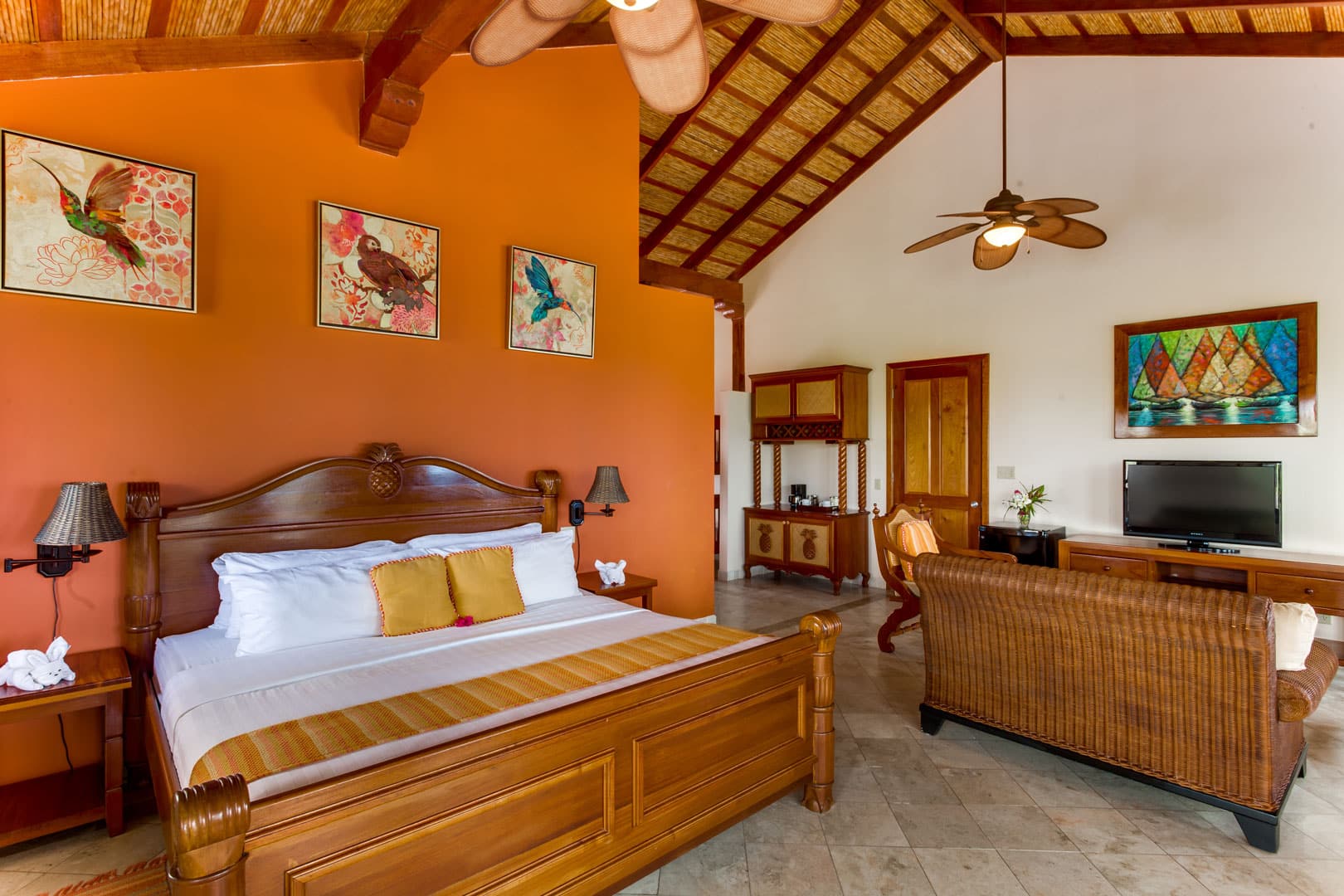 Front facing view of the king sized bed inside of the Colonial Penthouse Rooms at The Colonial Inn