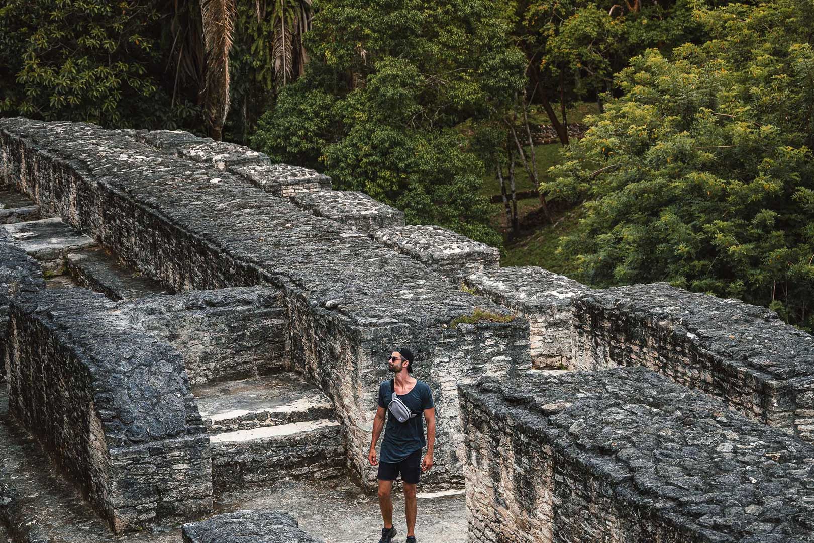 A guest at the top of El Castillo Maya temple at the Xunantunich Maya Site at The Rainforest Lodge at Sleeping Giant Resort