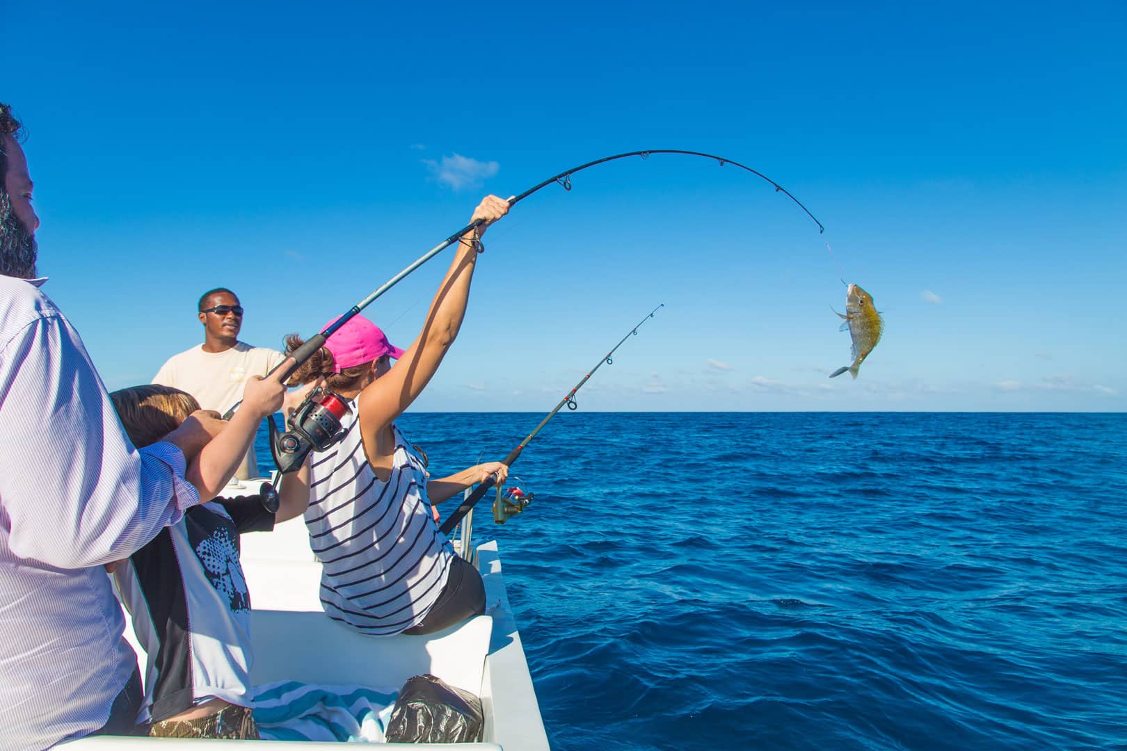 A fish on a fishing pole being reeled in at the Barrier Reef Light Tackle Sport Fishing at The Lodge at Jaguar Reef