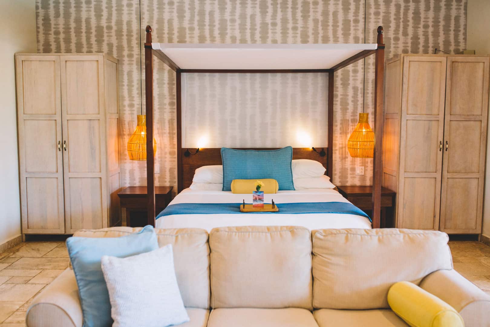 View of the bedroom area from the living area inside of the Deluxe Suite Upper Level with Plunge Pool at The Lodge at Jaguar Reef Resort