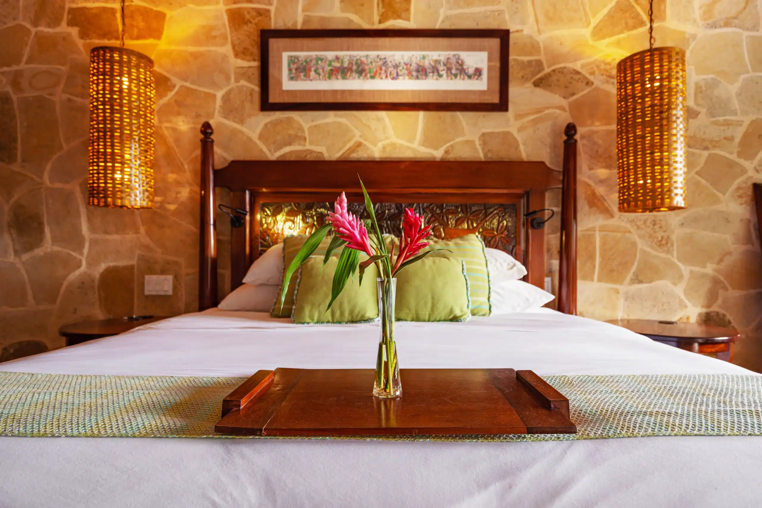 The front view of the king sized bed inside of the Mountain View Suites at The Rainforest Lodge at Sleeping Giant