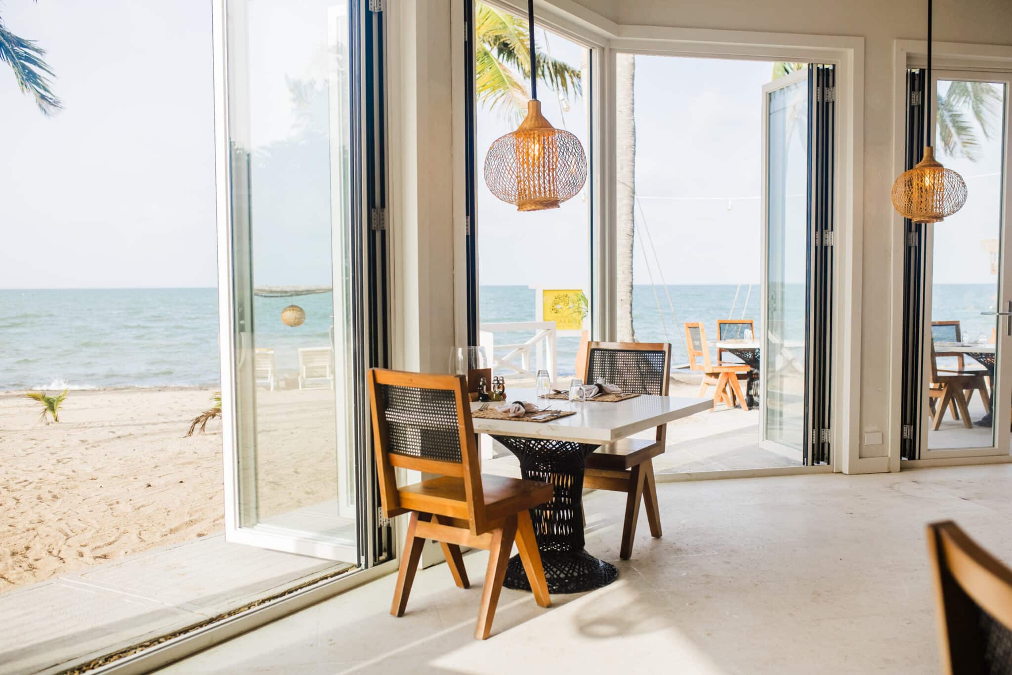Beachfront dining area at Paddle House Restaurant, The Lodge at Jaguar Reef, Hopkins, Belize