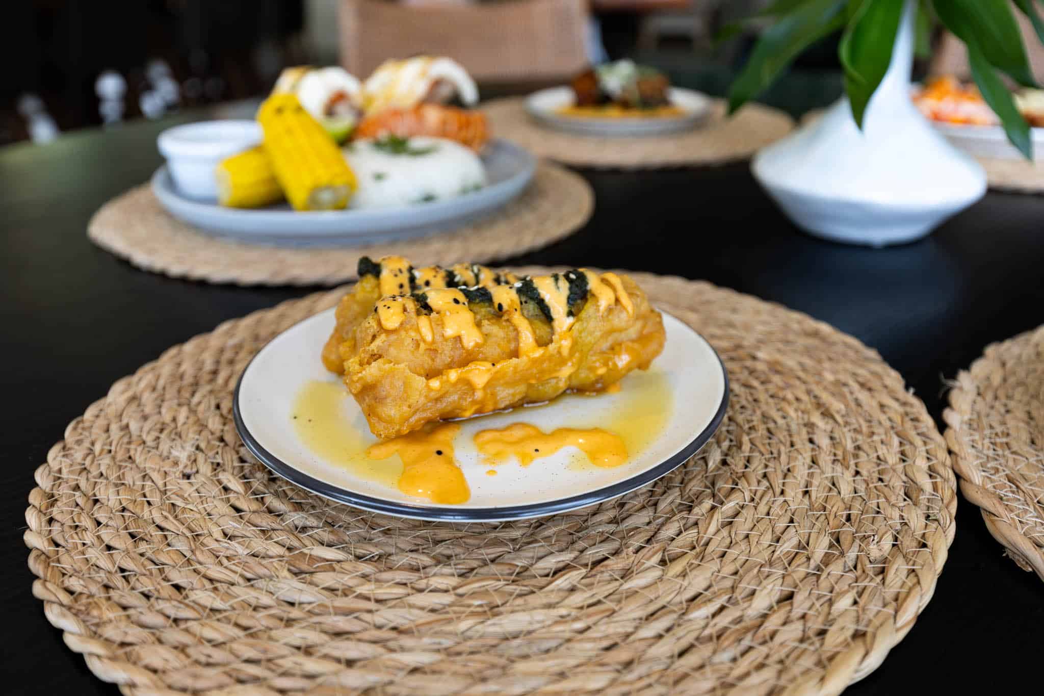 Table spread of dishes at Bamboo Beach Bistro, Placencia, Belize